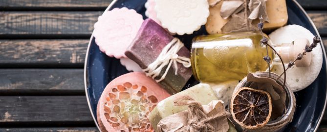 Still life of spa products with soap on wooden table